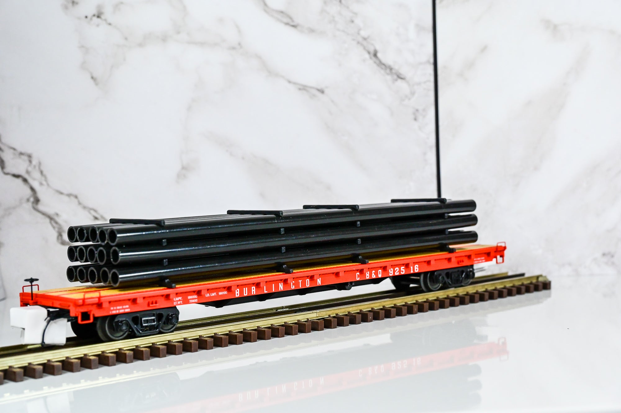 MTH Burlington  60' Flat Car w/Pipe Load #92516 | O Scale
