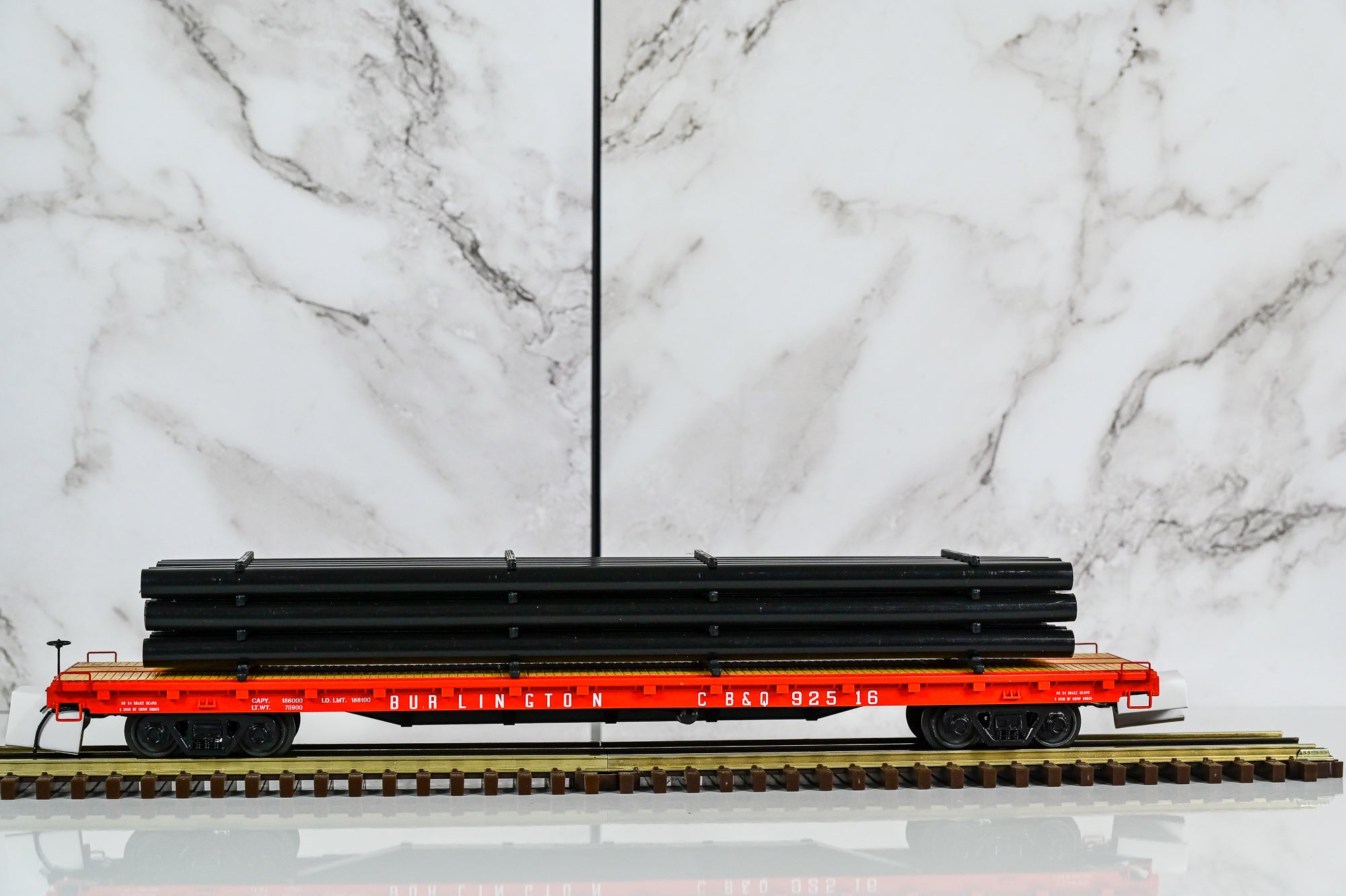 MTH Burlington  60' Flat Car w/Pipe Load #92516 | O Scale