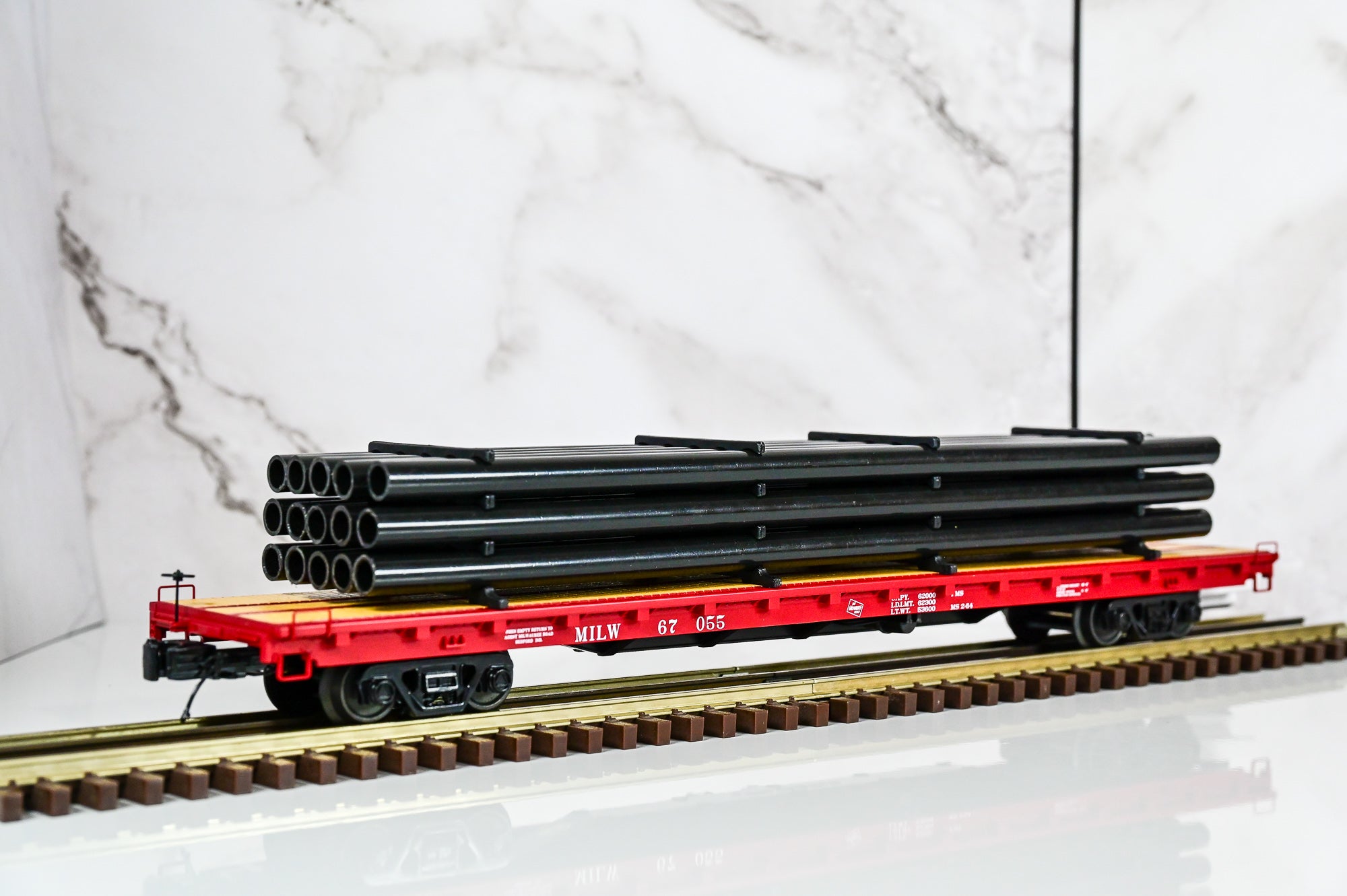 MTH Milwaukee Road 60' Flat Car w/Pipe Load #67055 | O Scale