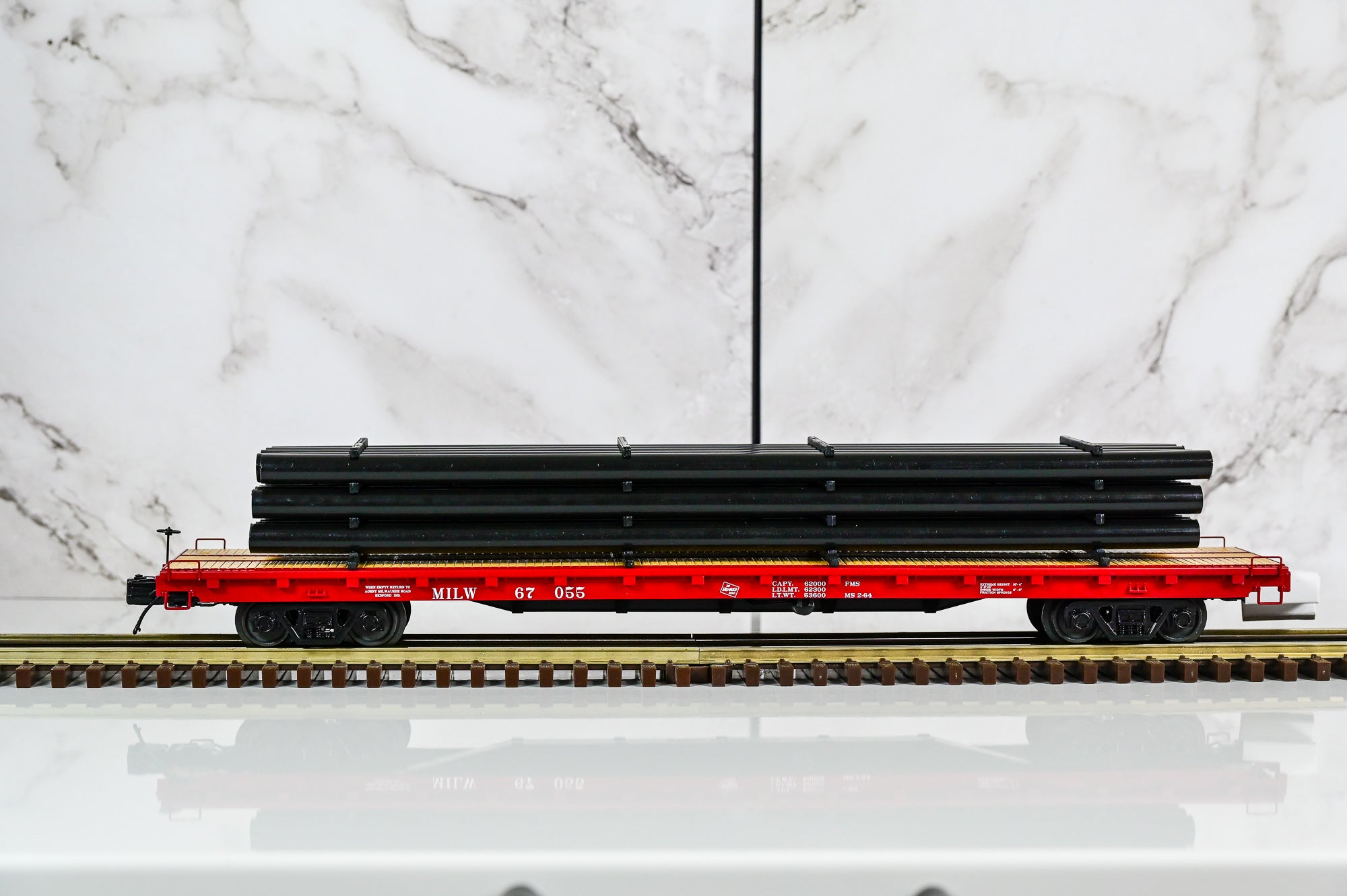 MTH Milwaukee Road 60' Flat Car w/Pipe Load #67055 | O Scale